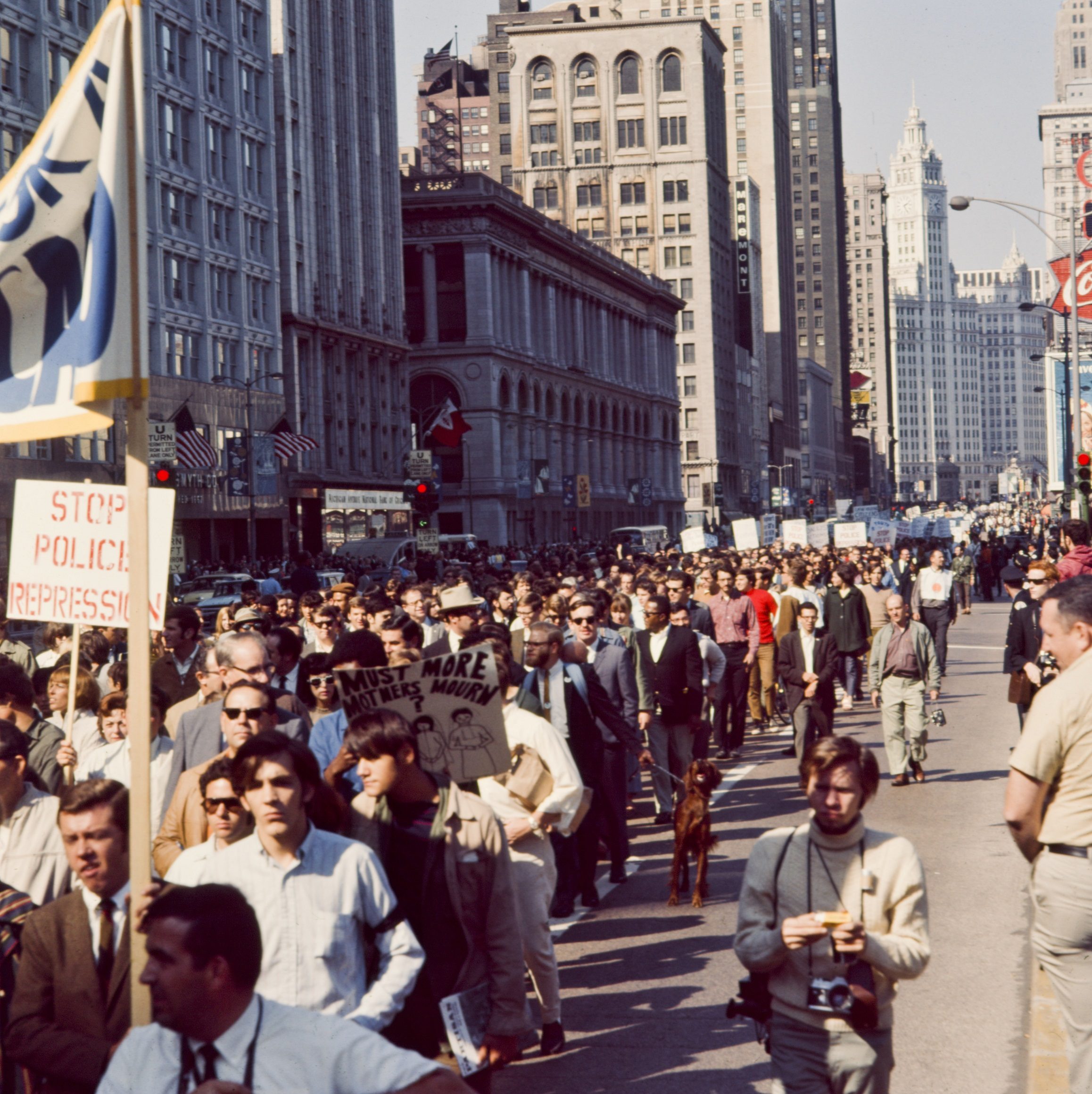 View of protesters at the 1968 Democratic National Convention, marching down Michigan Avenue.