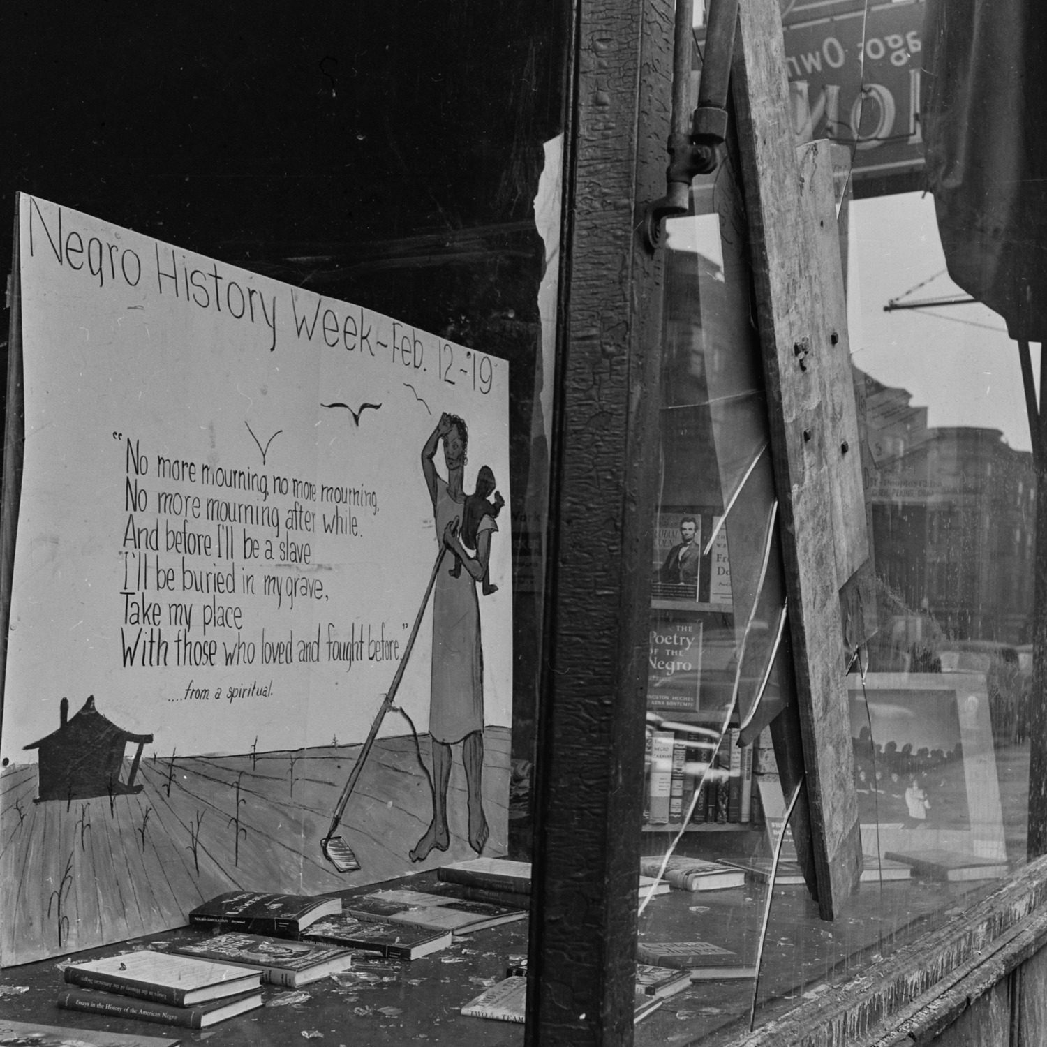 Sign for 'Negro History Week' in the storefront window of Community Book Shop owned by Joan Place at 1404 East 55th Street, in the Hyde Park neighborhood of Chicago, 1951