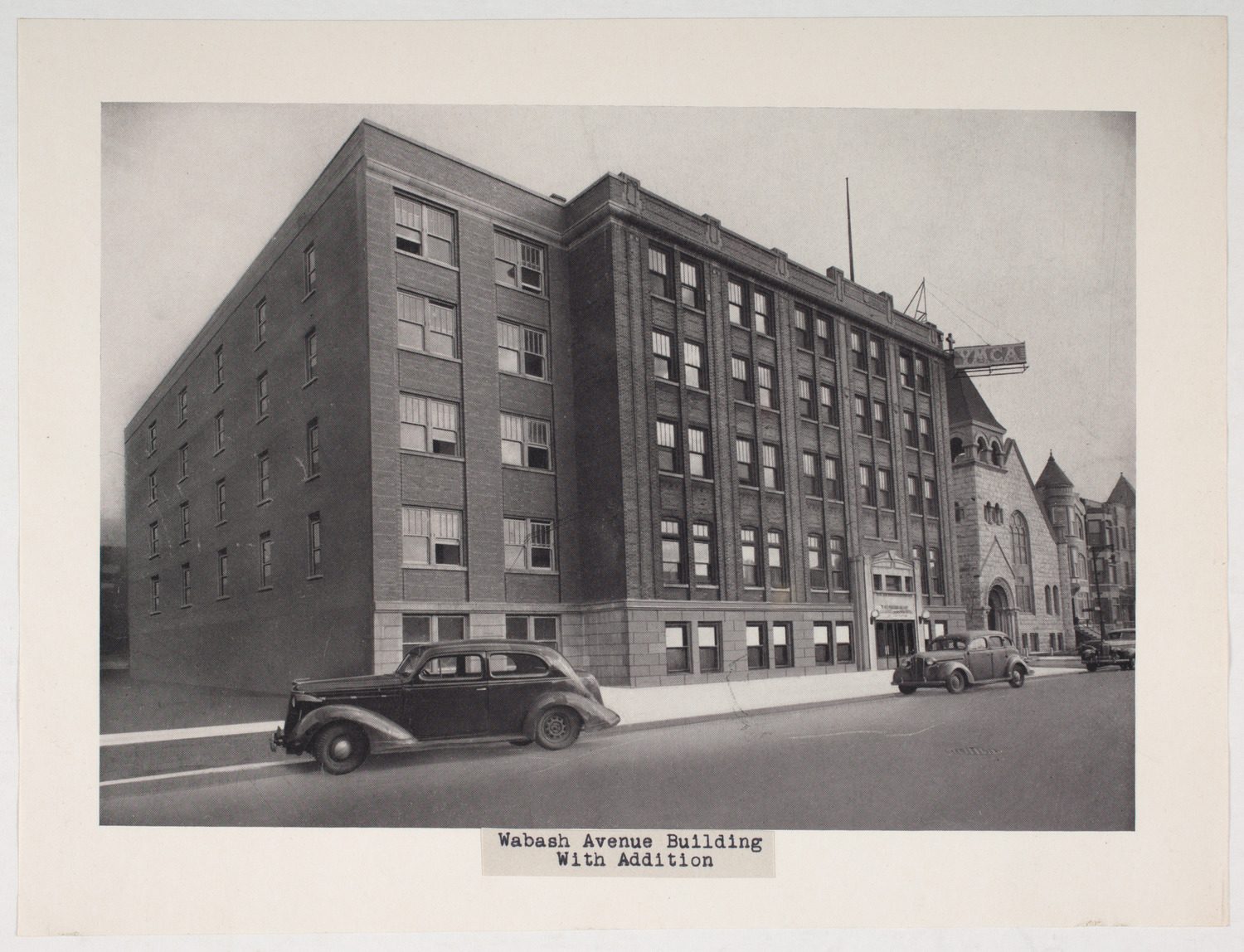 Exterior view of YMCA of Metropolitan Chicago Wabash Avenue Building with addition in the Douglas community area of Chicago, circa 1940