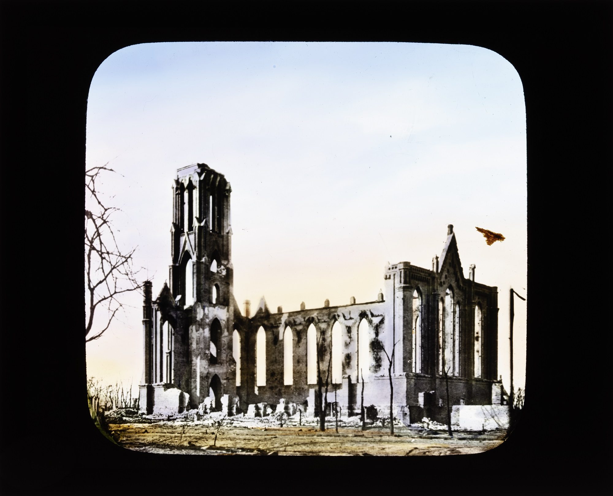 Hand-colored slide showing the exterior of the Holy Name Cathedral ruins after the Great Chicago Fire