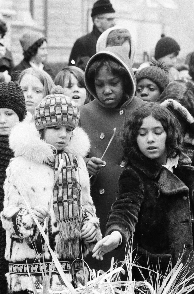 School children fill a barrel with palms that nuns then burn for Ash Wednesday in front of Holy Name Cathedral