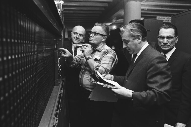 Alderman John Hoellen, Congressman Roman Pucinski and others watching vote recount, Chicago, Illinois.