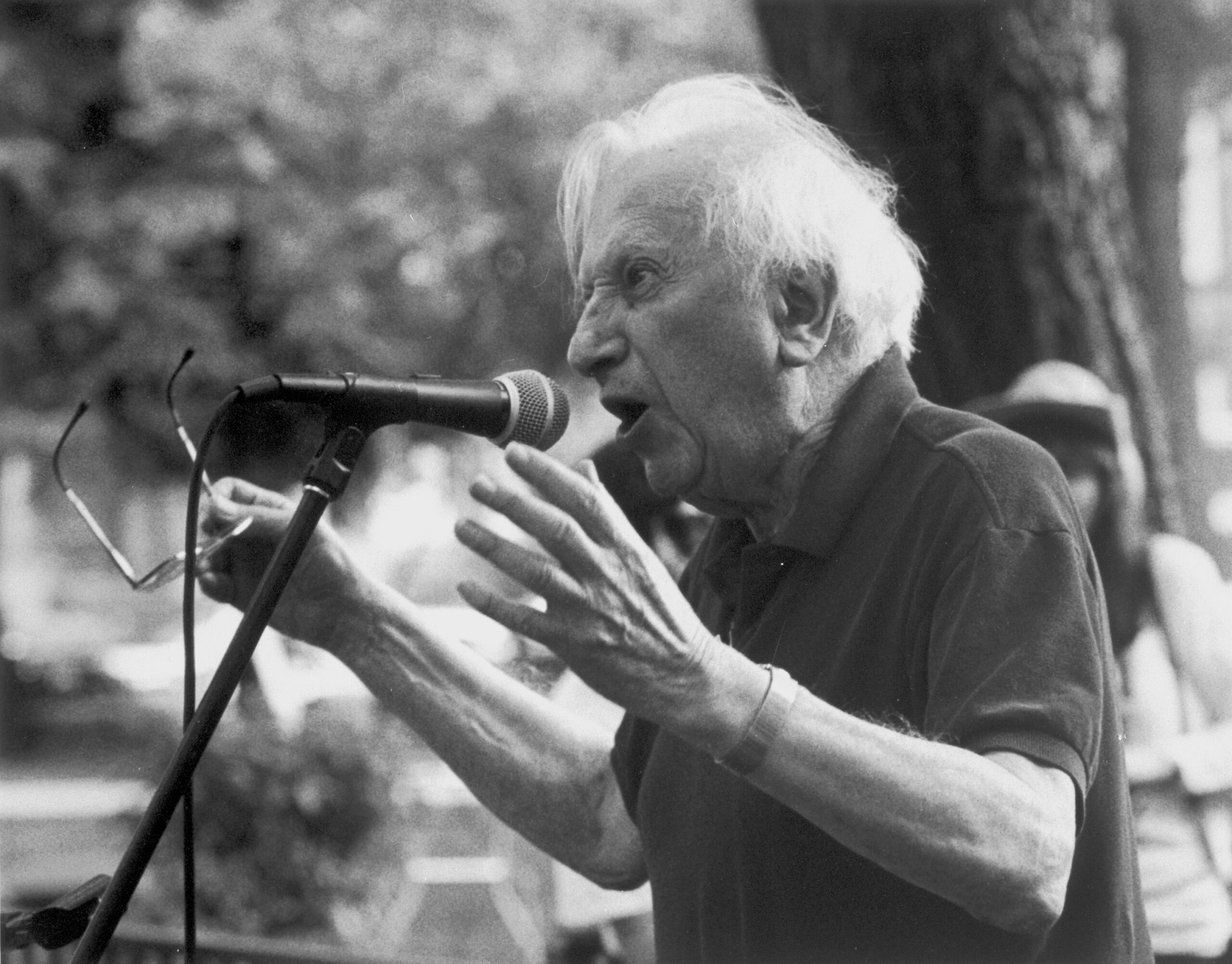 Studs Terkel making a speech in a park