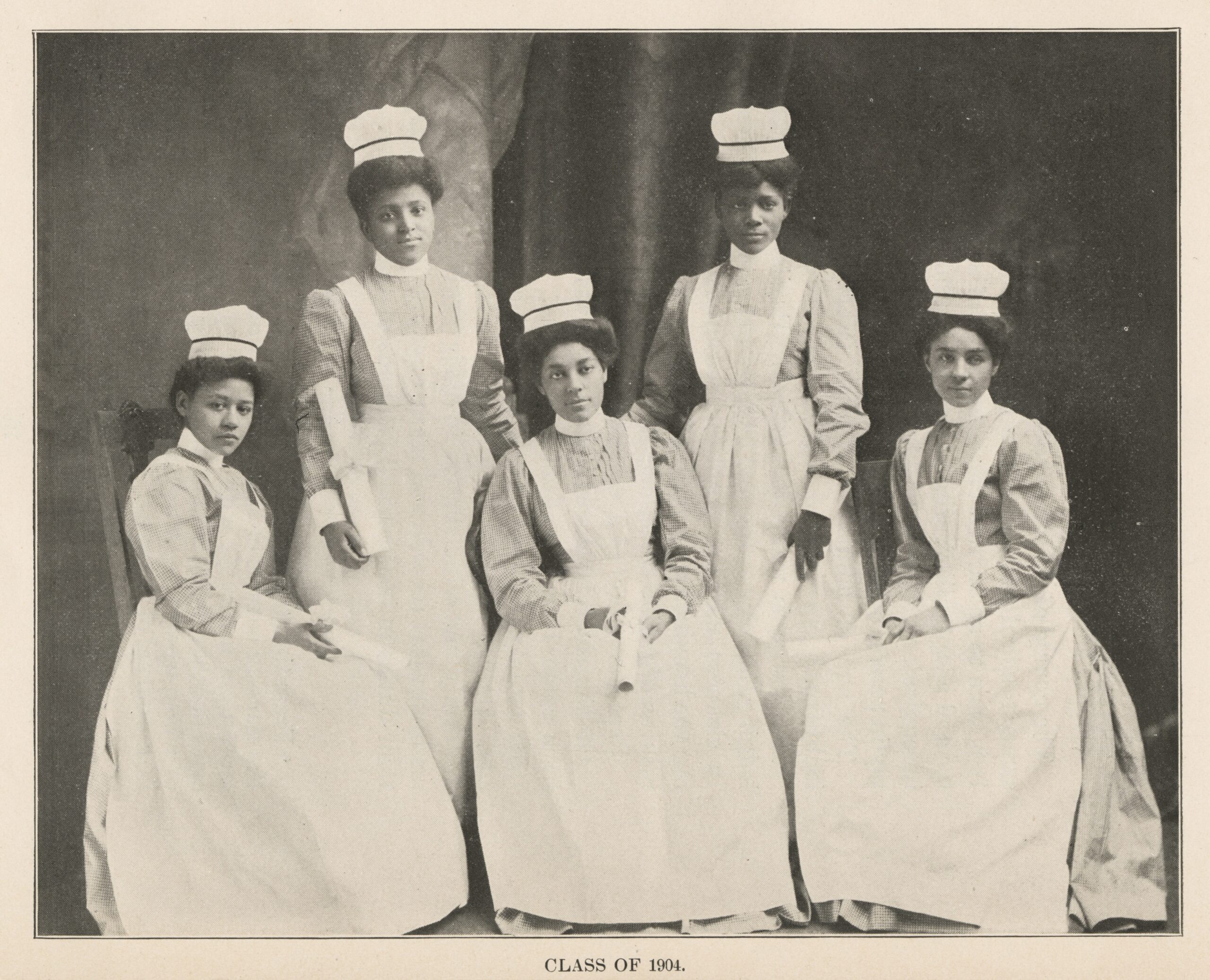 Five Black nurses in 1904 nurse uniforms