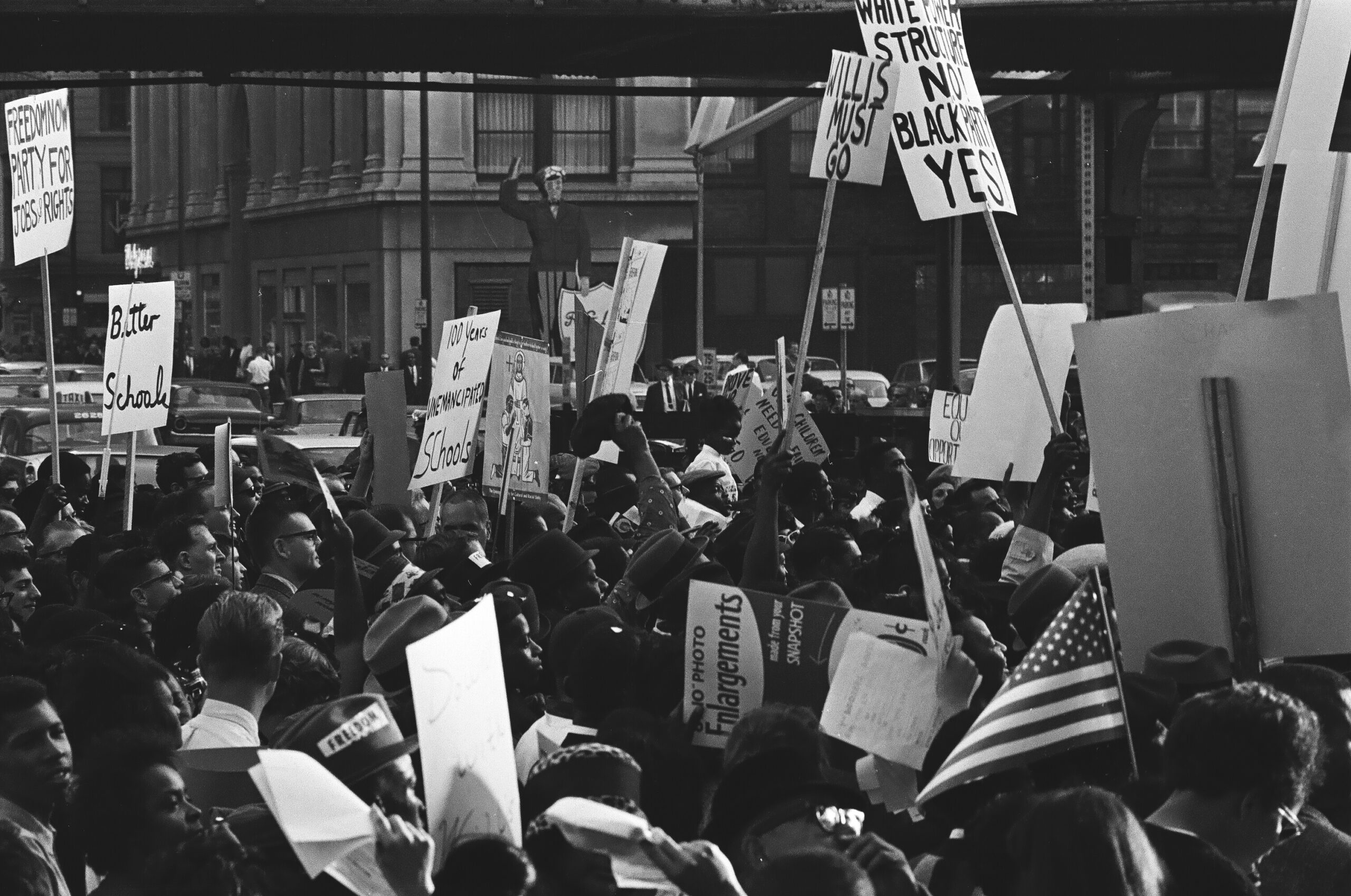 black and white photo of protestors with signs