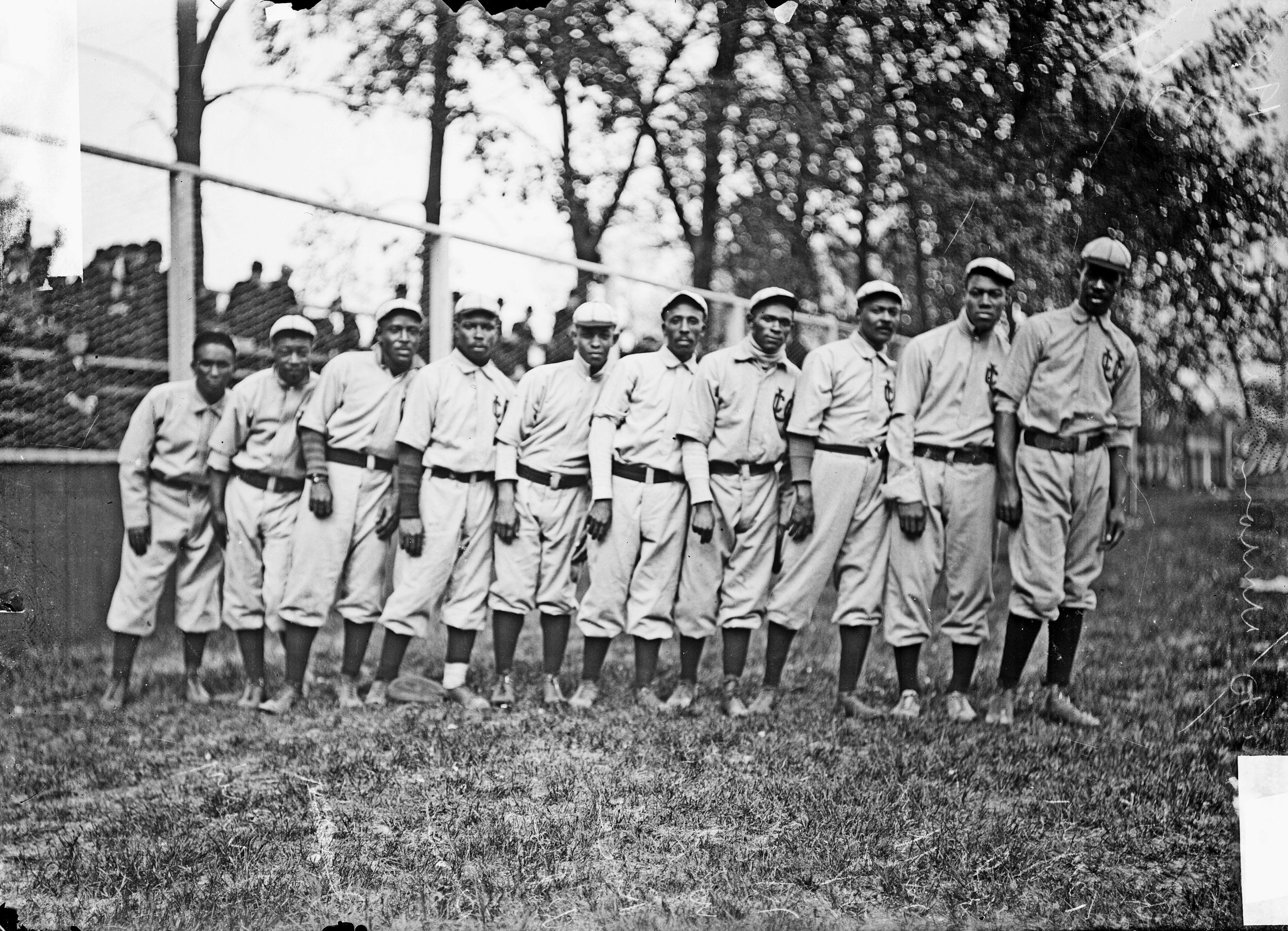 Negro National League's Chicago American Giants baseball team players standing on the field
