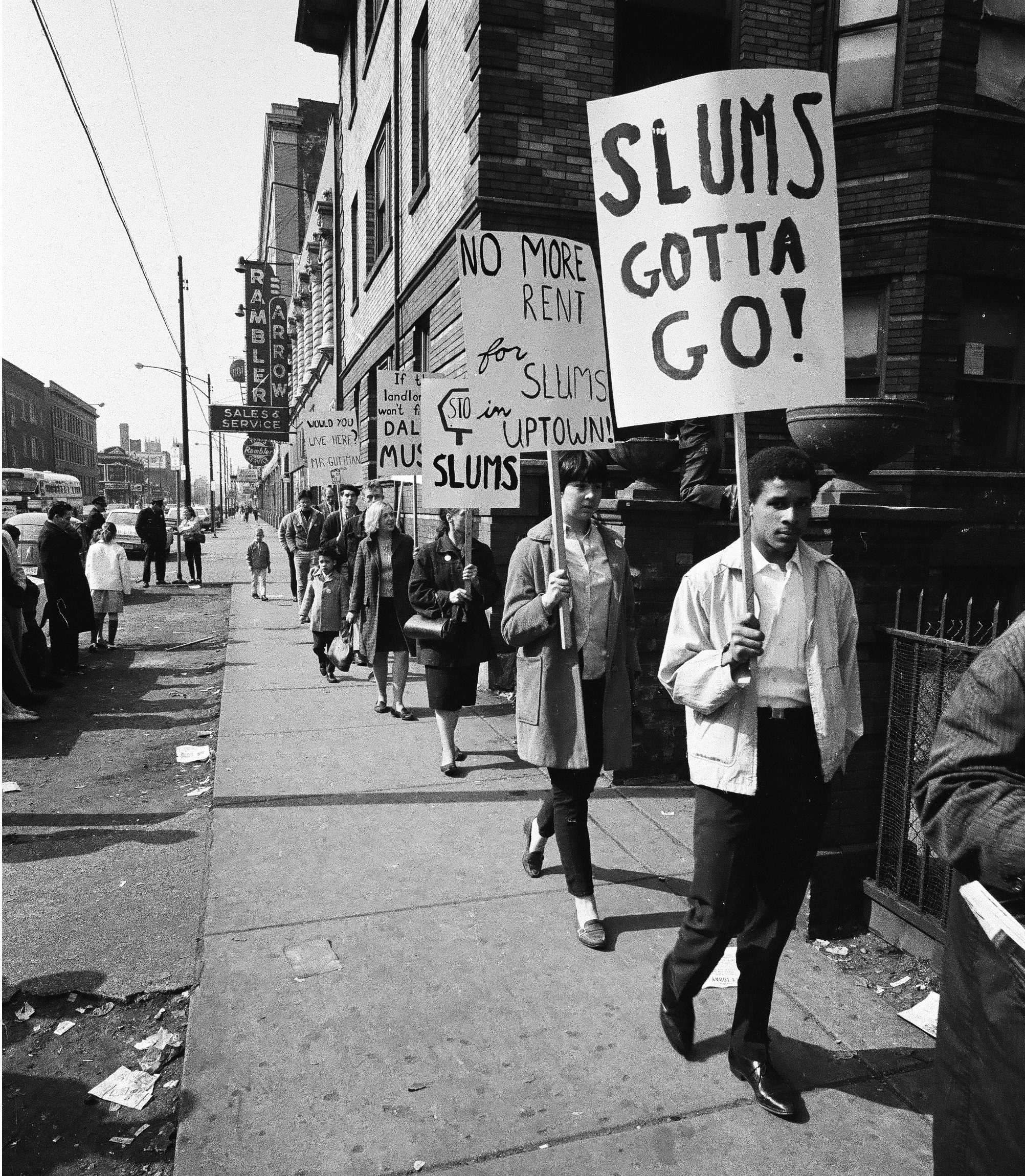 Protestors walk along a sidewalk holding rent strike signs, Chicago, September 30, 1966. ST-40000567-0024, Chicago Sun-Times collection, CHM