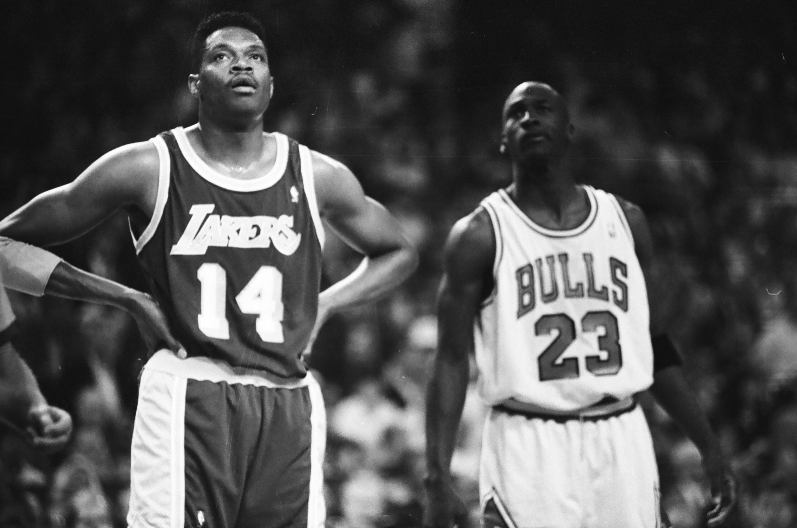 Sam Perkins and Michael Jordan stand next to each other during the game