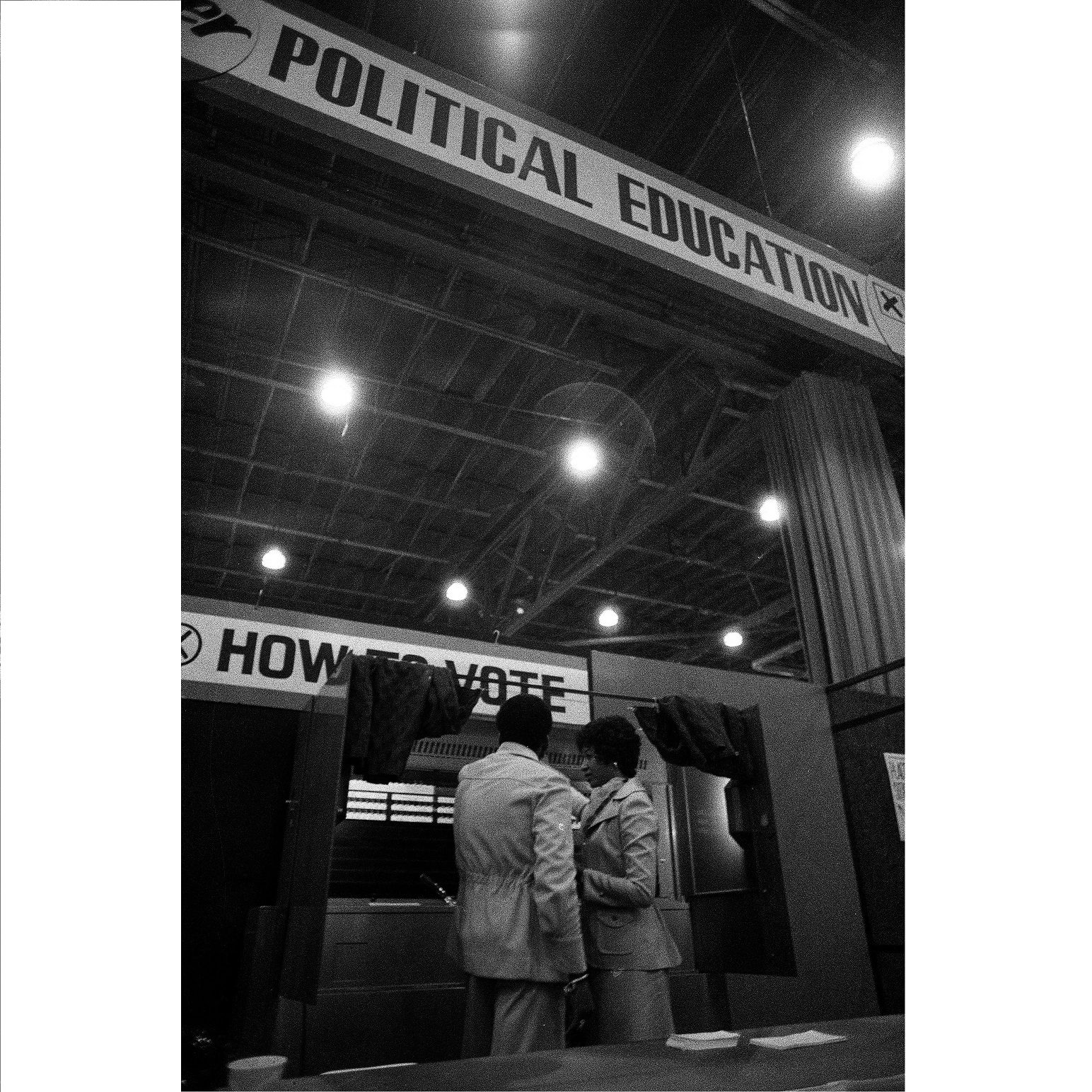 Cecilia Pickens of the Chicago Board of Election Commissioners demonstrates how to use a voting machine