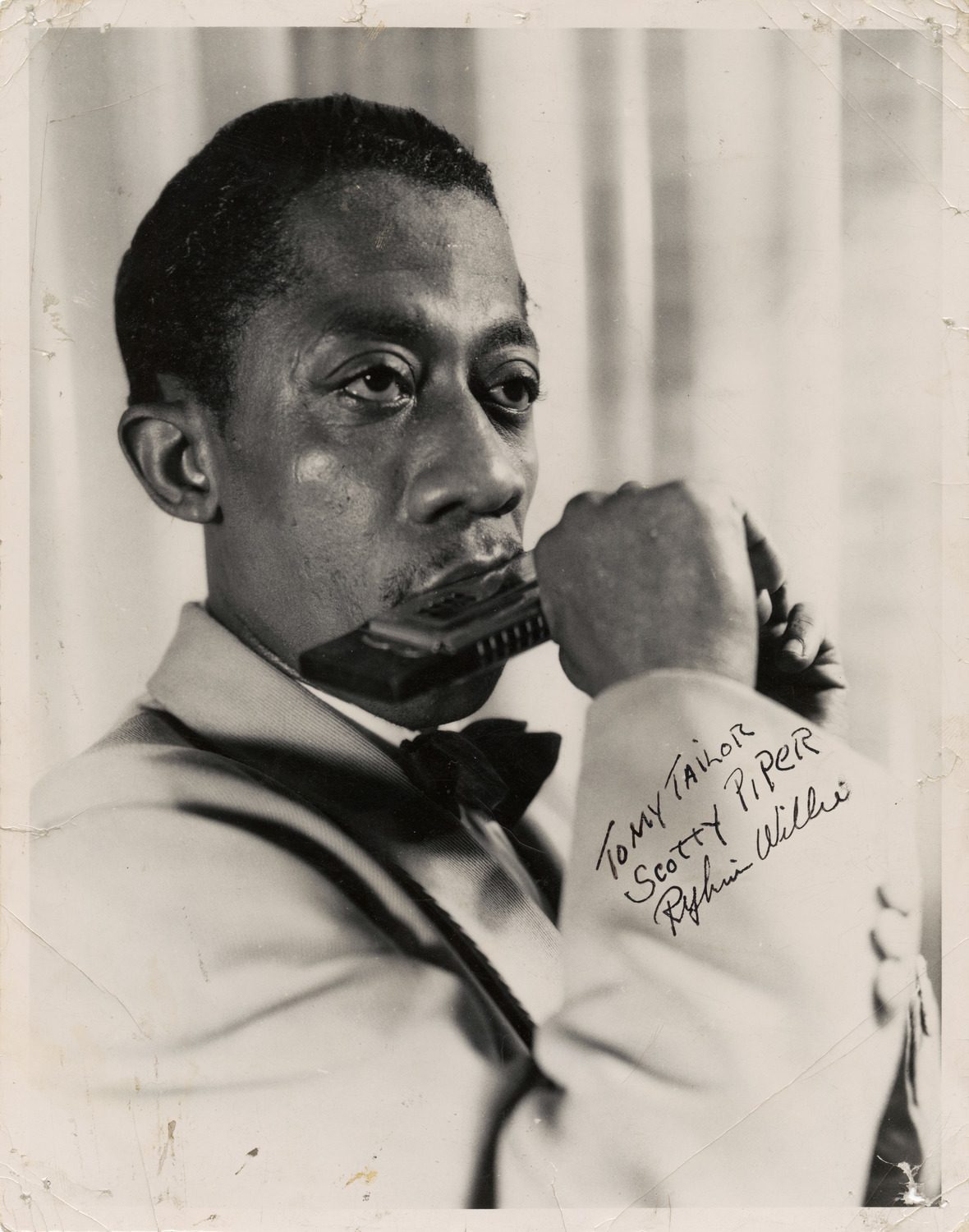 Signed head shot of Rhythm Willie. The inscription reads: "To my tailor Scotty Piper. Rhythm WIllie"