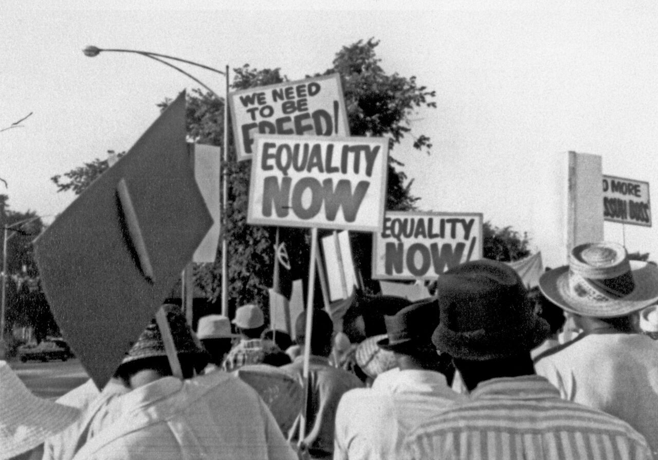 Crowd holding signs at a Martin Luther King Jr. rally