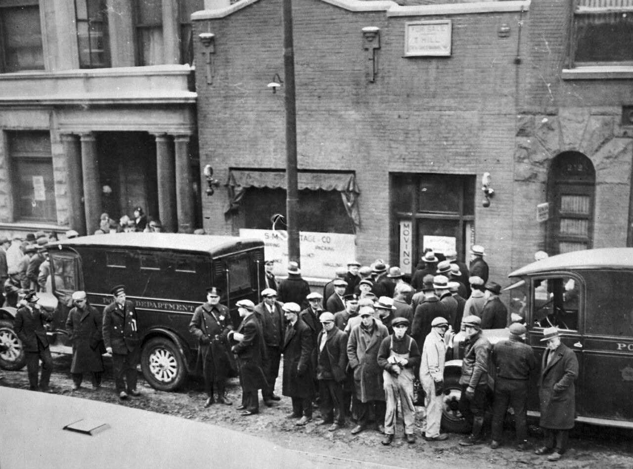 Crowd and policemen at the site of St. Valentine’s Day Massacre