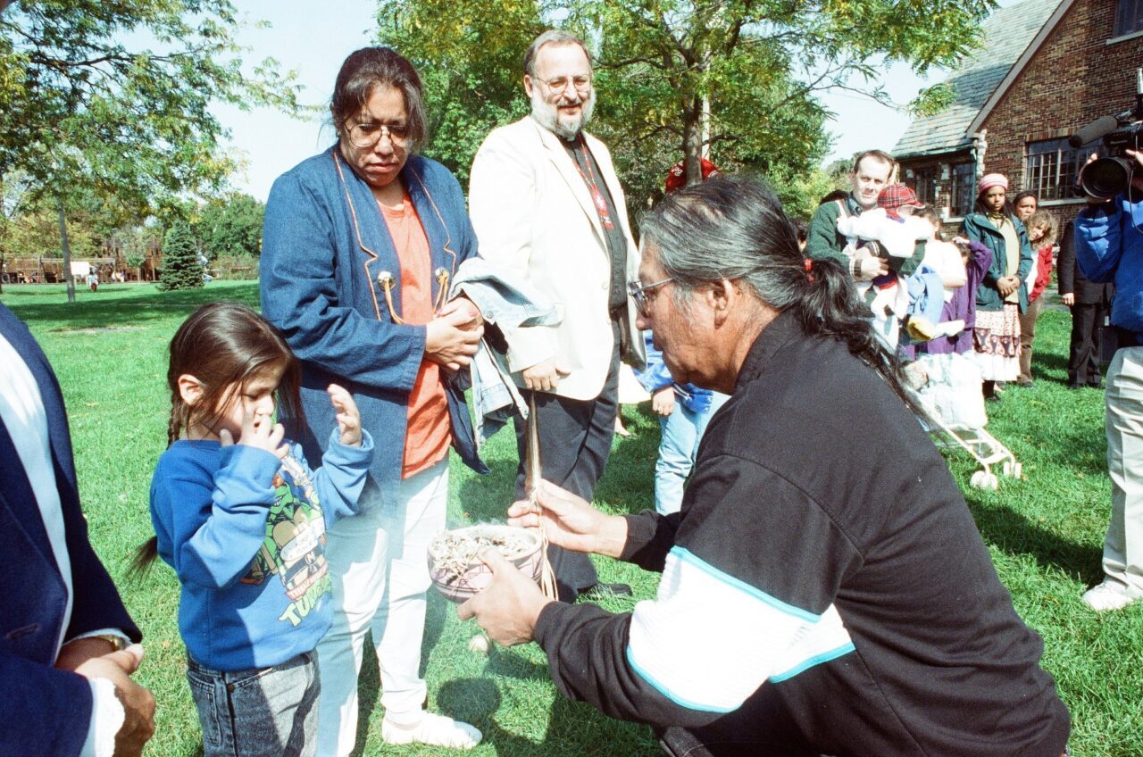 Residents of Native American descent hold a vigil in protest of Columbus Day festivities at Indian Boundary Park
