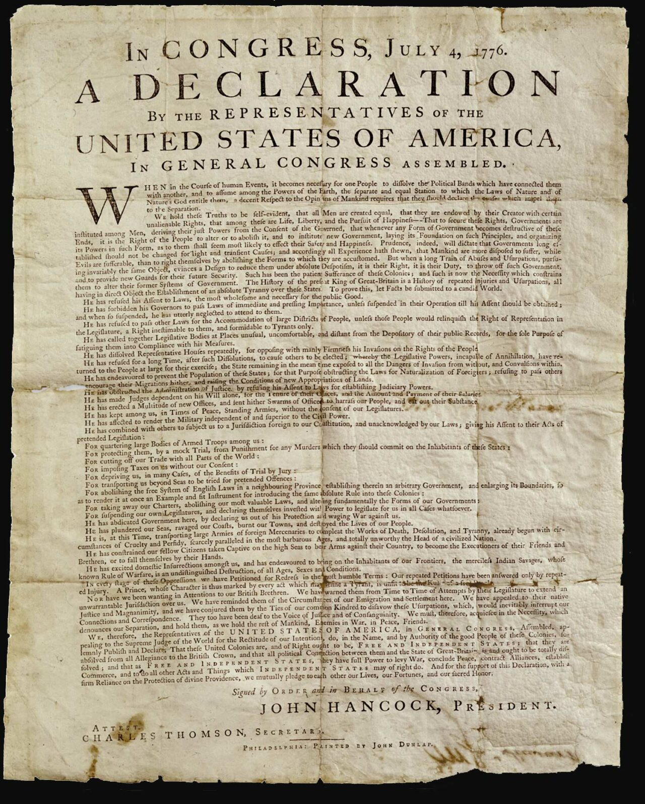 A copy of the Declaration of Independence, browned with age and originally folded.